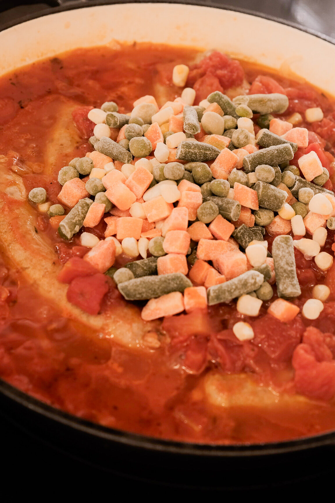 Adding frozen veggies to stewed Italian sausage