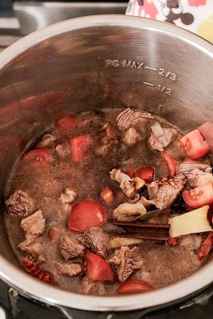 adding water to the stew