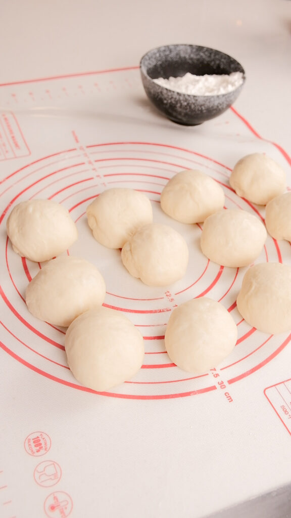 Rolling the dough into balls to rest