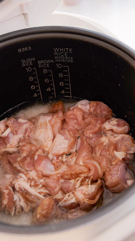 Coconut chicken rice before cooking
