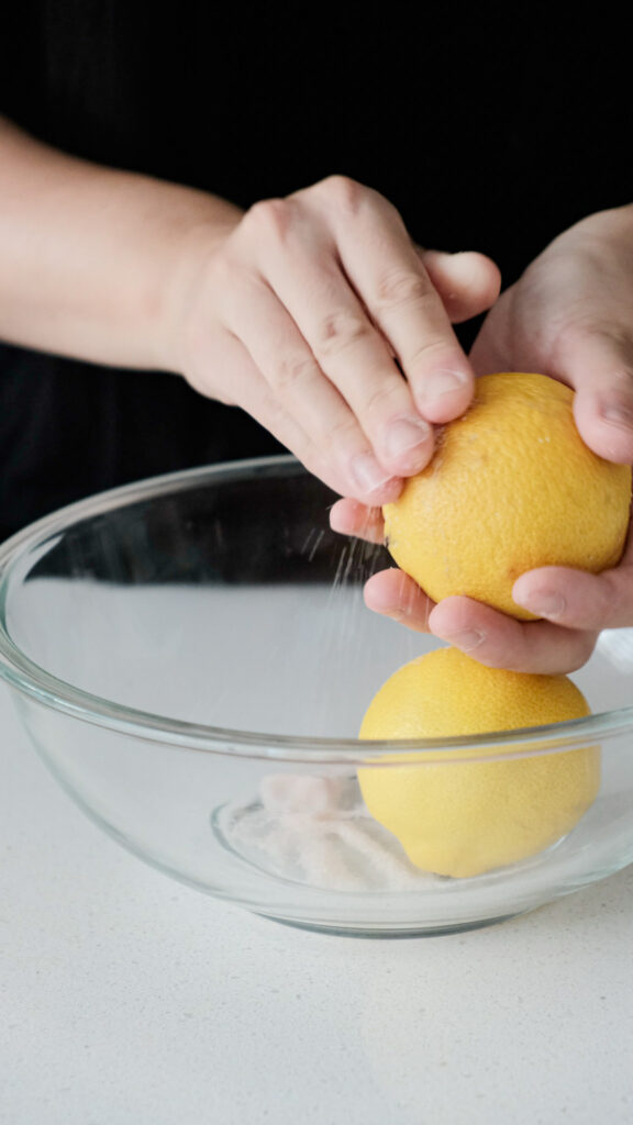scrubbing the lemons with salt