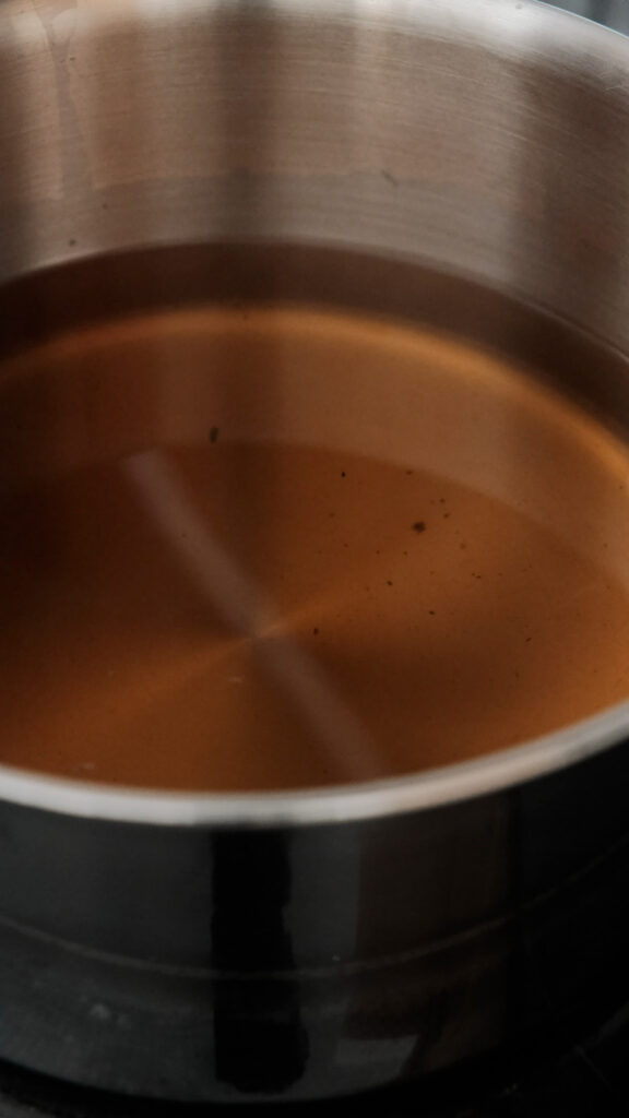straining out the tea leaves