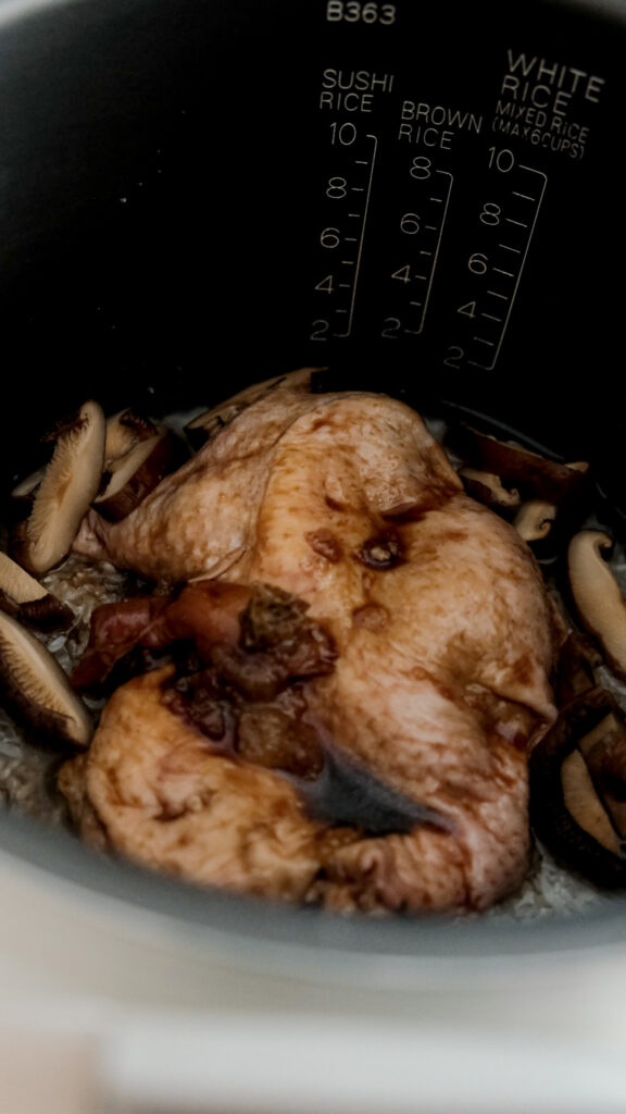 Chicken and mushroom in rice cooker with rice
