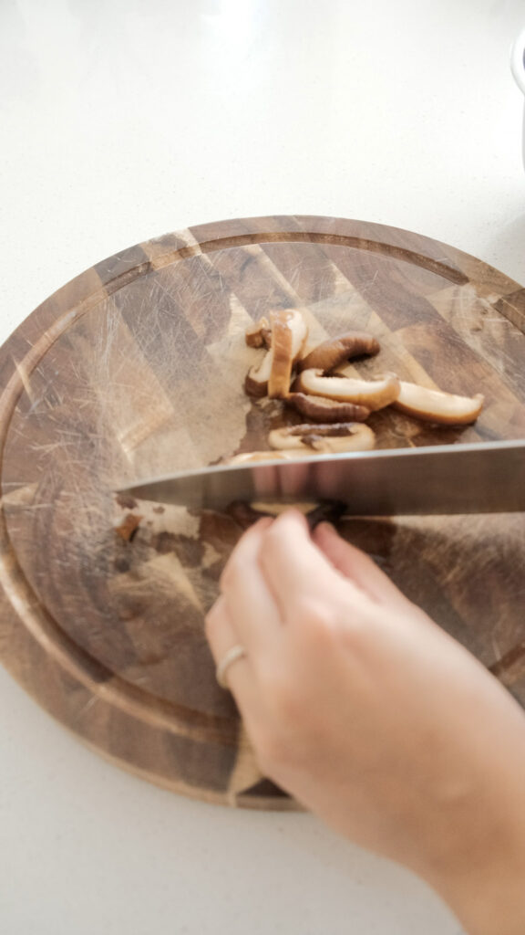 Cutting shiitake mushroom into slices