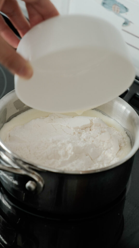Adding flour into butter