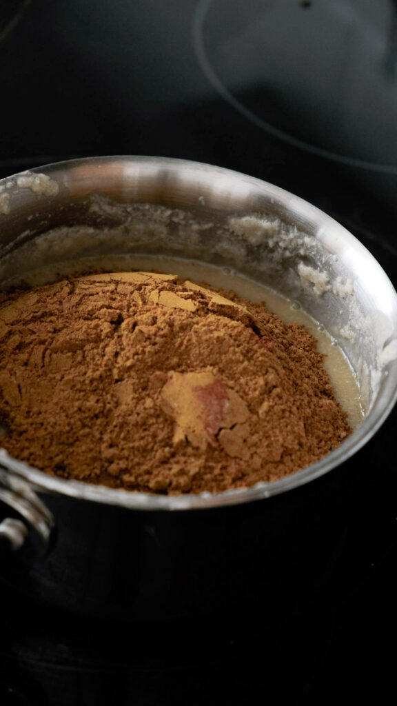 Adding the spices into the flour and butter mixture