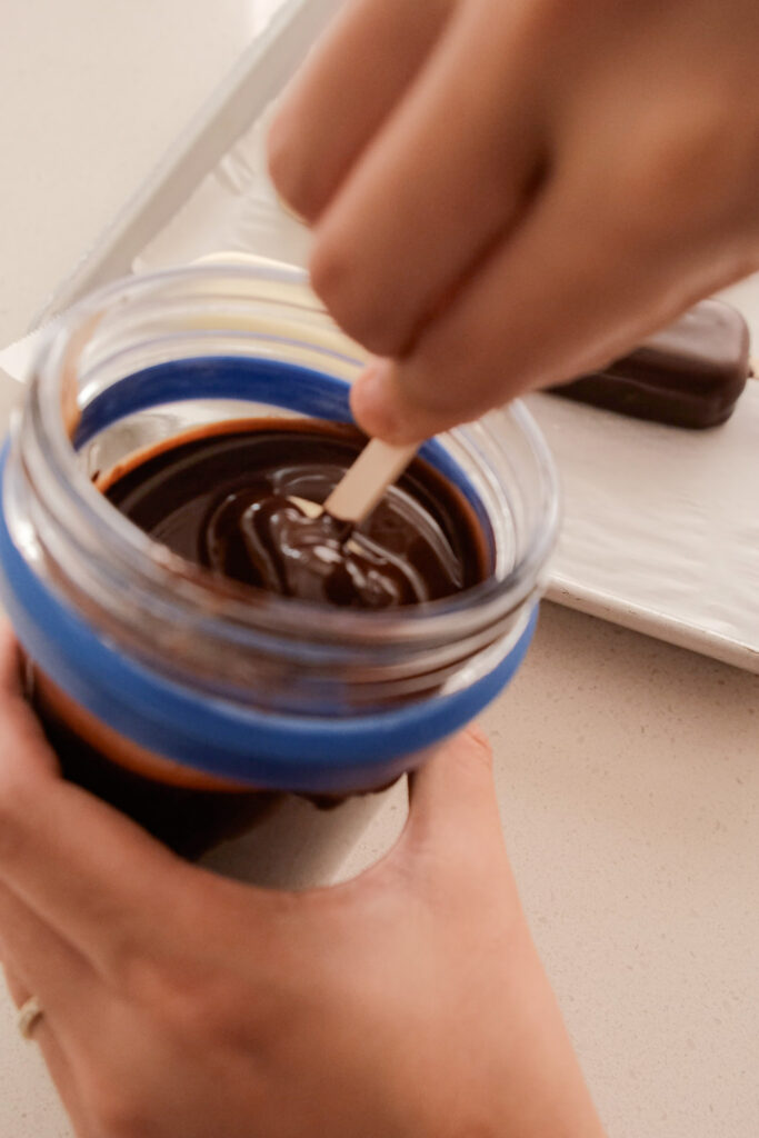 Dipping the mango ice cream bars