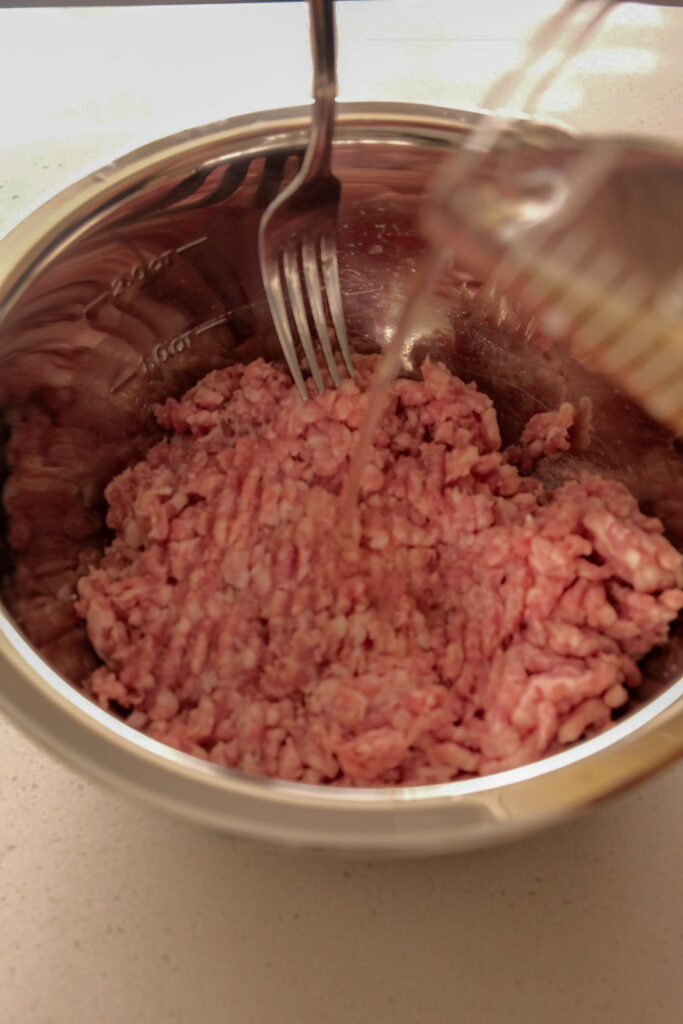 Adding aromatic water to ground meat
