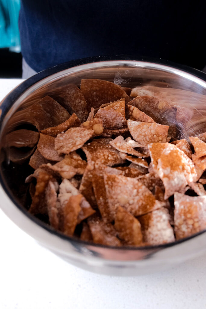 Putting spices on the air fryer chips