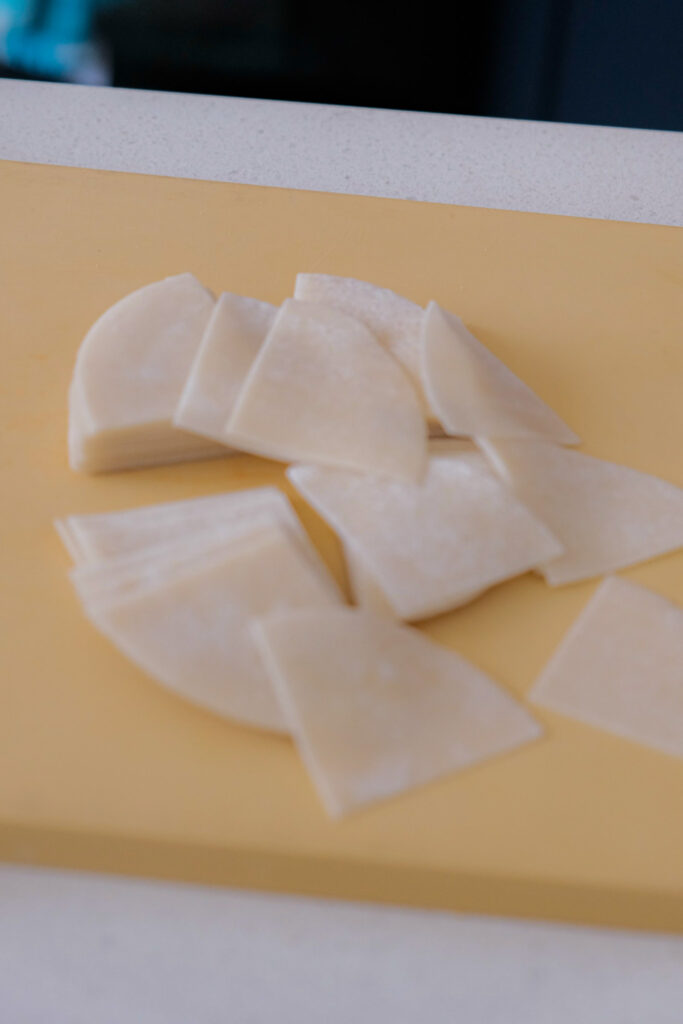 Cutting dumpling wrappers into fourths