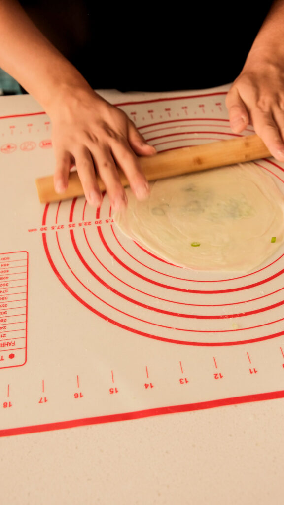 Rolling scallion pancake