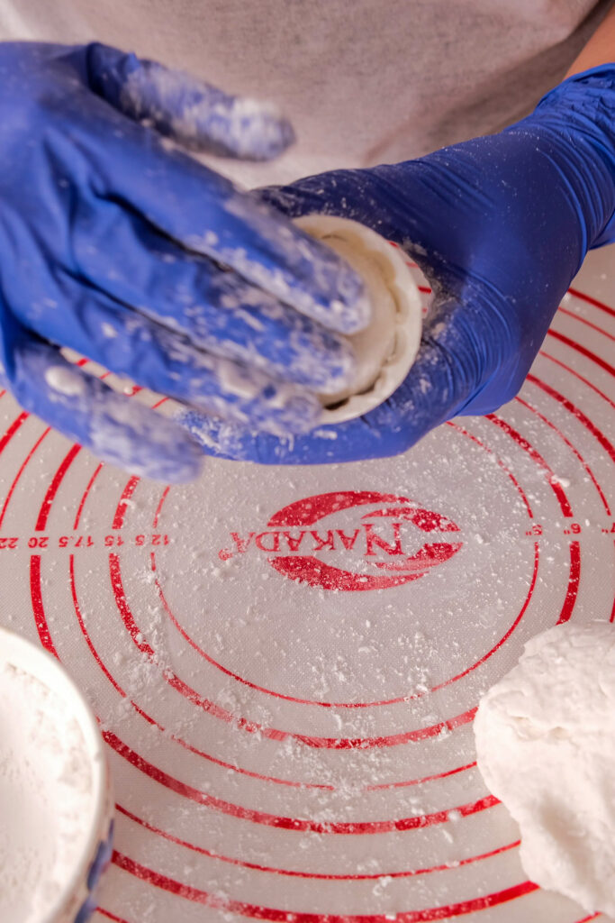 Pressing mooncake dough into mold