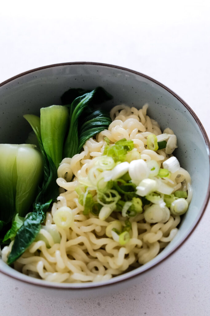 Scallions on top of the noodles
