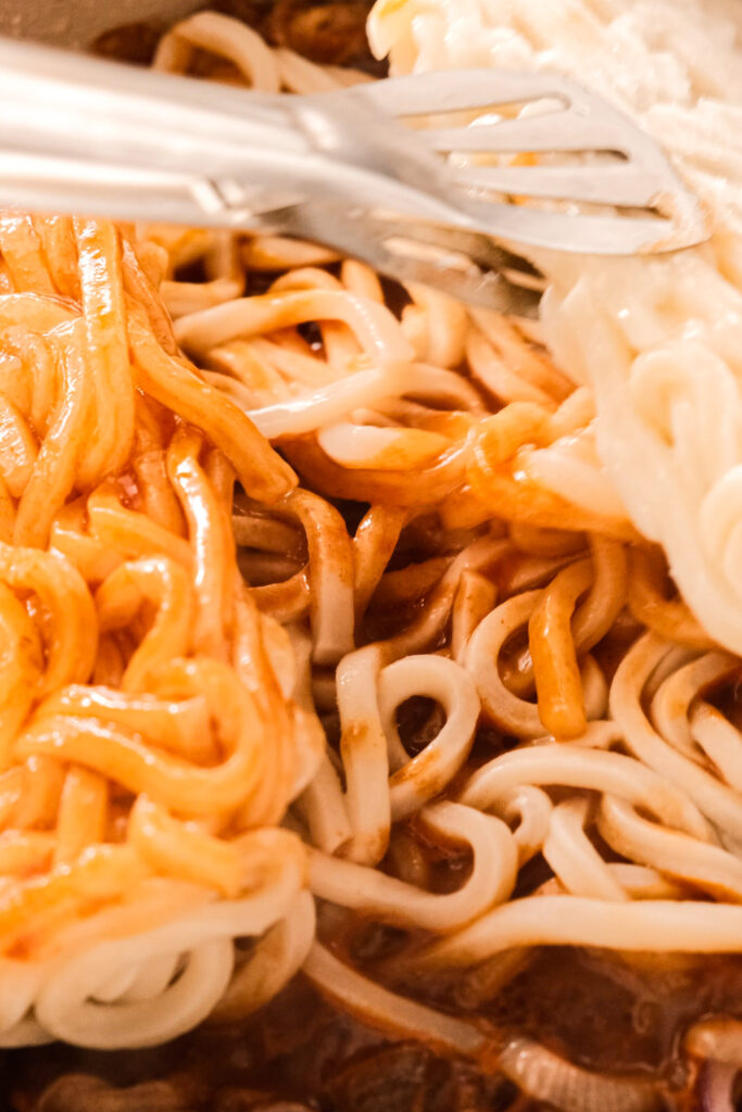 Moving the udon around soak up the sauce