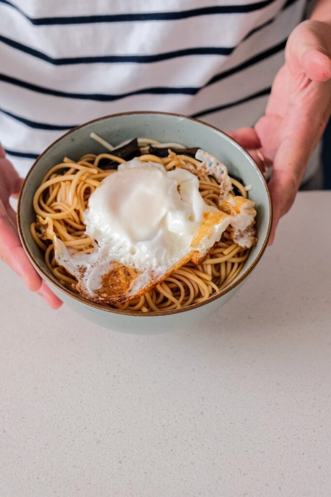 Scallion oil noodles with fried egg on top