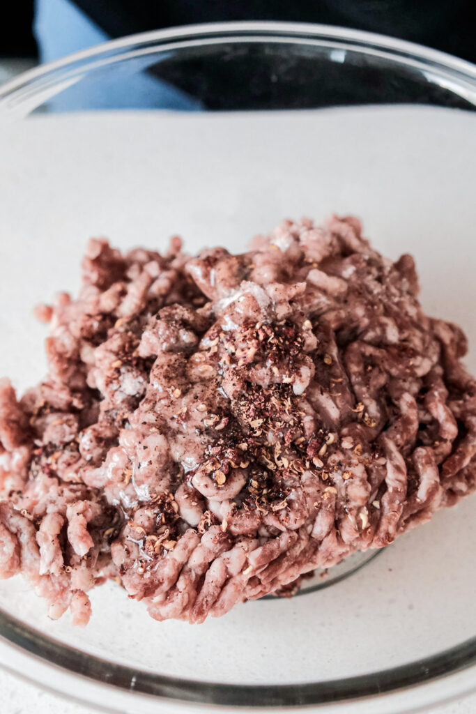 Adding ingredients to ground beef