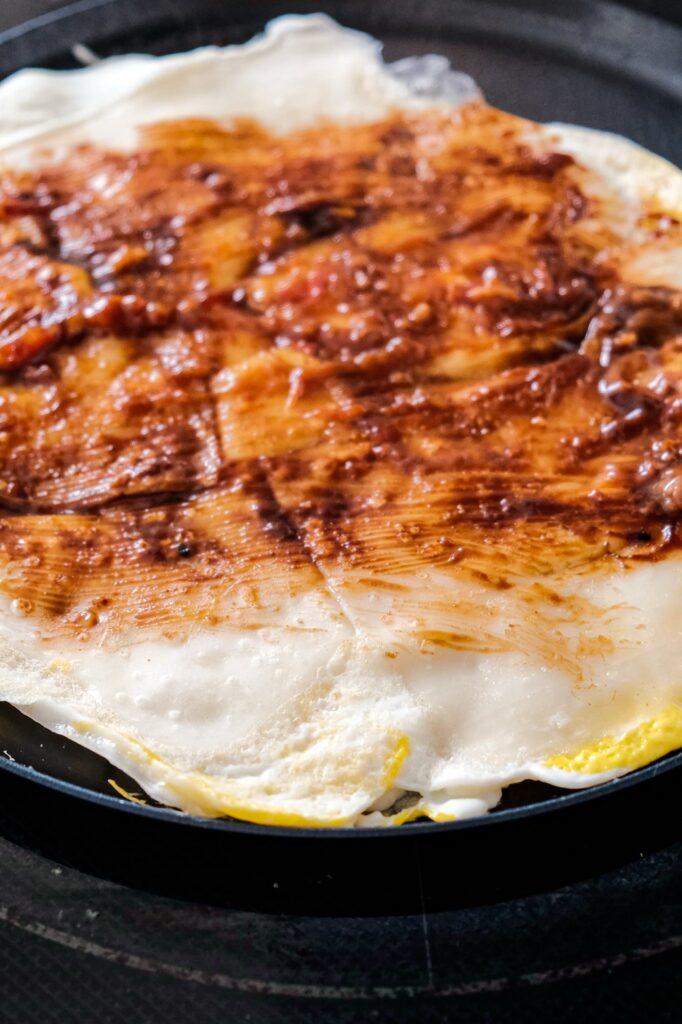 Brushing sauce on top