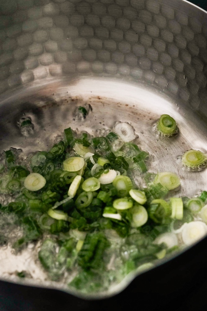 Stir frying scallions
