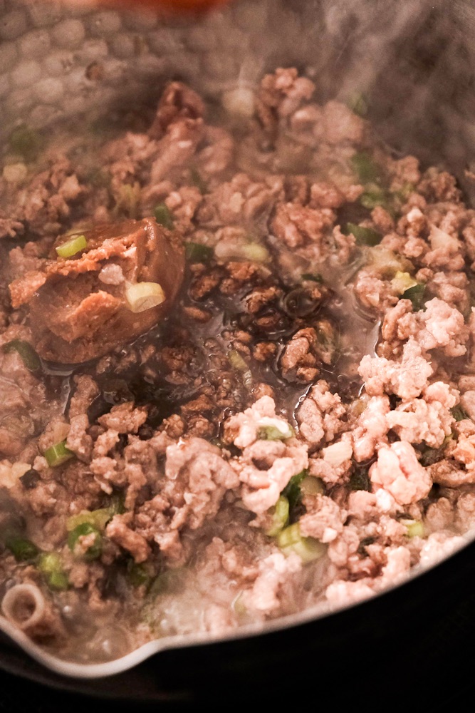 Adding seasoning to the ground meat